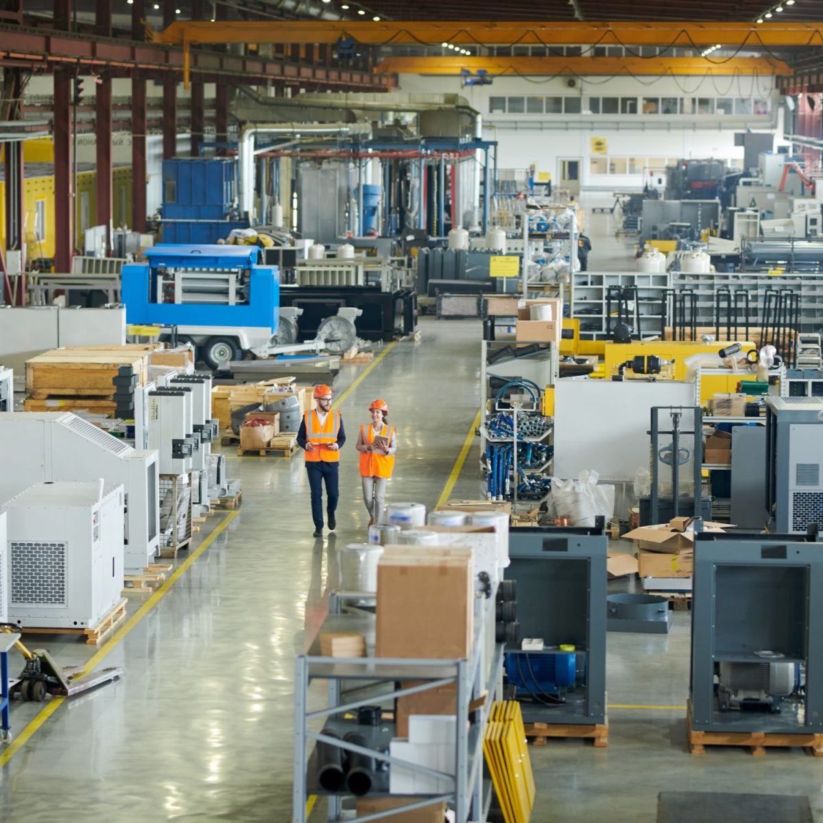 hardhat businessmen in the middle of factory